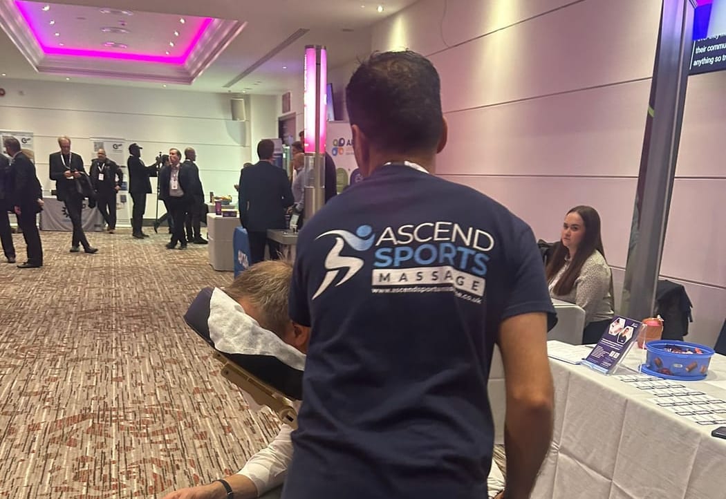 Pramod giving chair massage at a workplace event