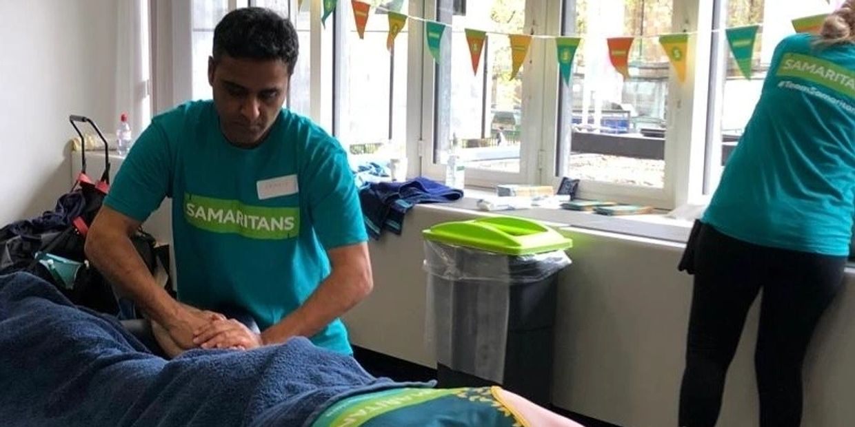 Pramod volunteering as a massage therapist for the Samaritans at the London Marathon